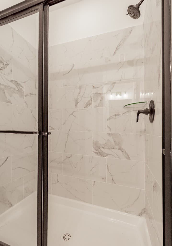 Jenkins Avenue — walk-in shower with marble tile